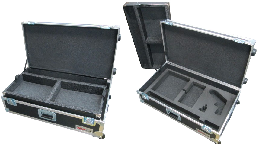 We see three black, opened road cases sitting against a white backdrop.