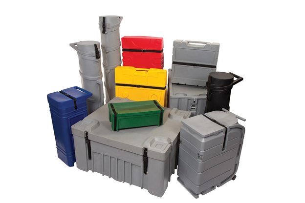 Against a white backdrop, we see a pile of grey, green, blue, yellow, and red roto-molded trade show shipping cases.